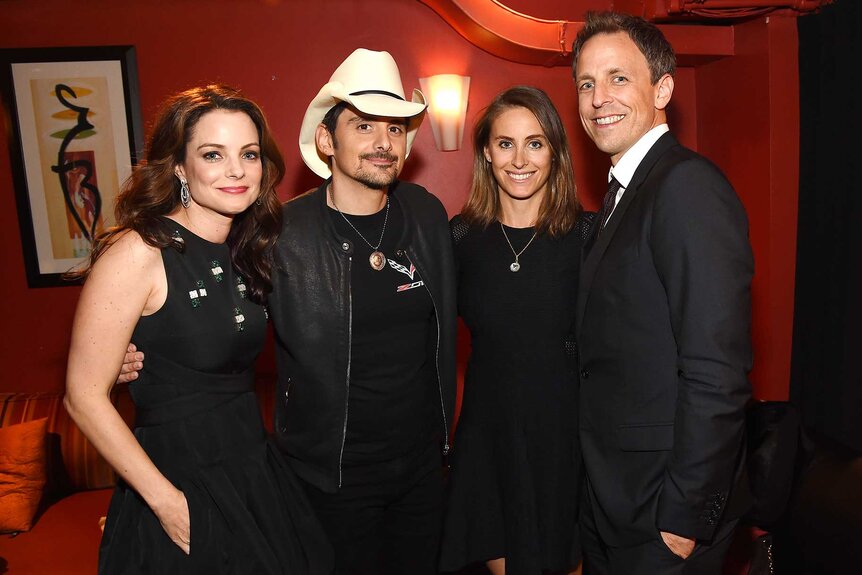 Kimberly Williams-Paisley with husband, Brad Paisley, and Alexi Ashe with husband, Seth Meyers, posing together at The Country Music Hall Of Fame & Museum All For The Hall New York Benefit Concert.