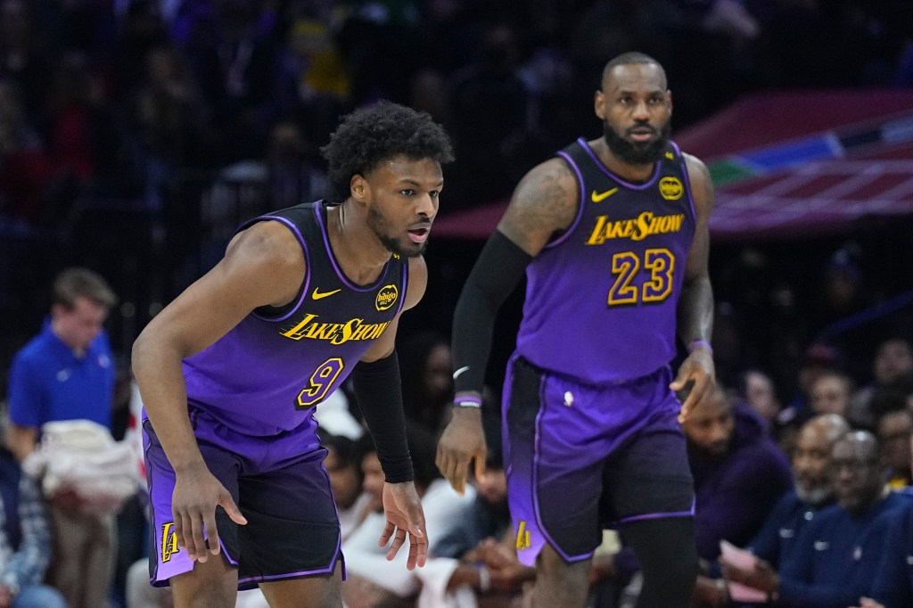 Bronny James #9 and LeBron James #23 of the Los Angeles Lakers play against the Philadelphia 76ers in the first half at the Wells Fargo Center on January 28, 2025 in Philadelphia, Pennsylvania. Getty Images
