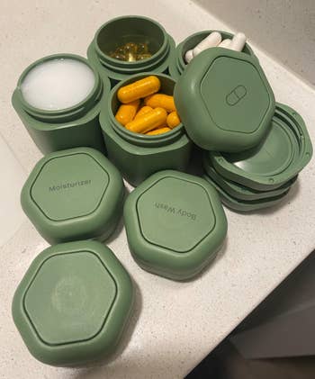 Travel-sized containers filled with toiletries and supplements, labeled