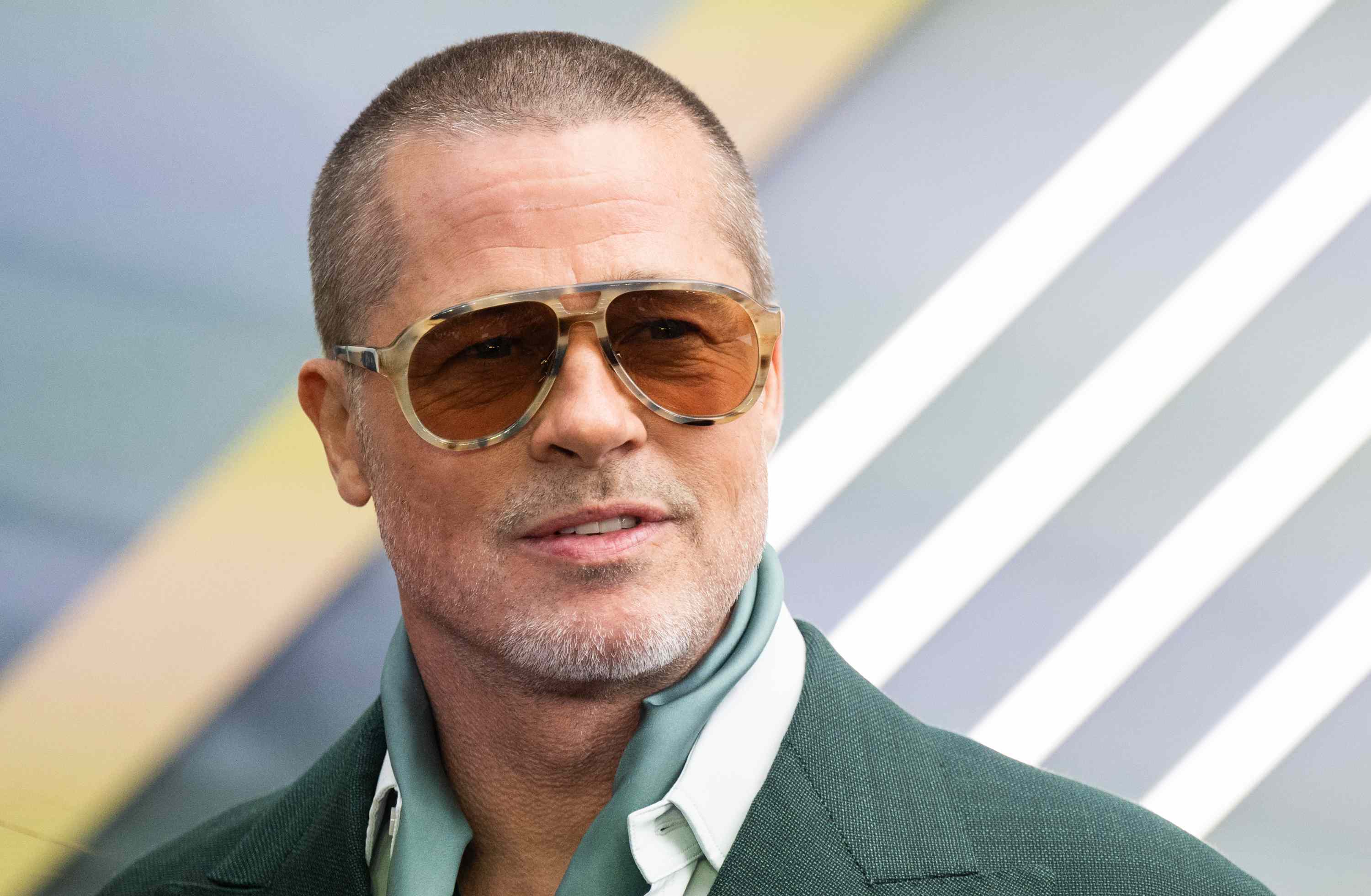 Brad Pitt Embraces His Natural Grays As He Grows Out His Buzz Cut