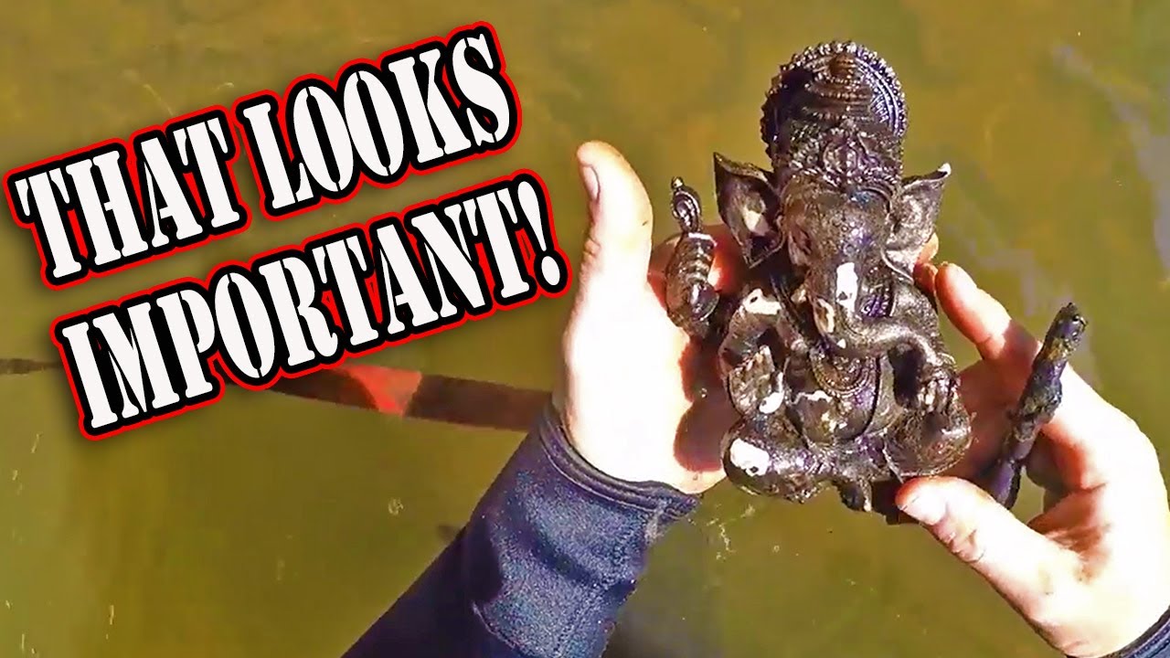 Submerged religious artifact and coin bottle recovered