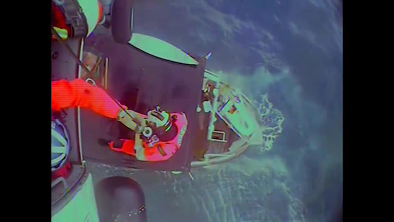Coast Guard rescues four people from sinking ship