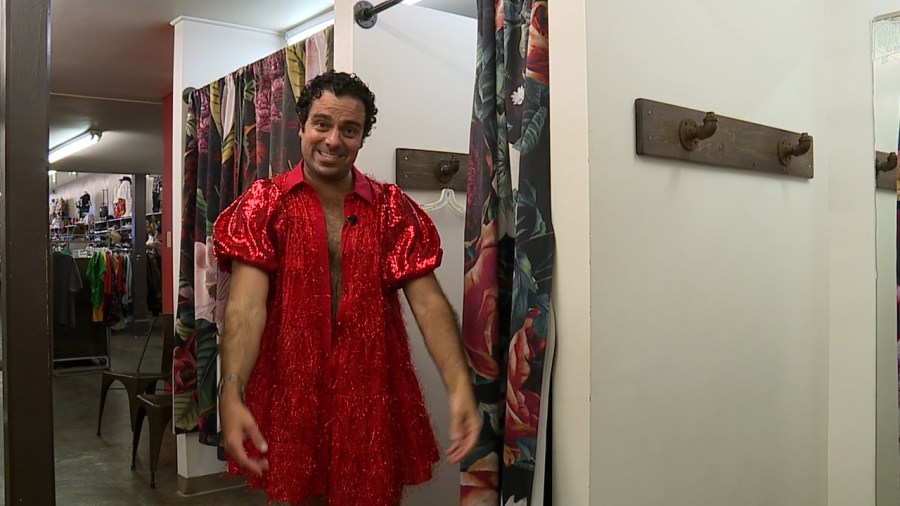Football players picking out their dresses for Red Dress Run in New Orleans