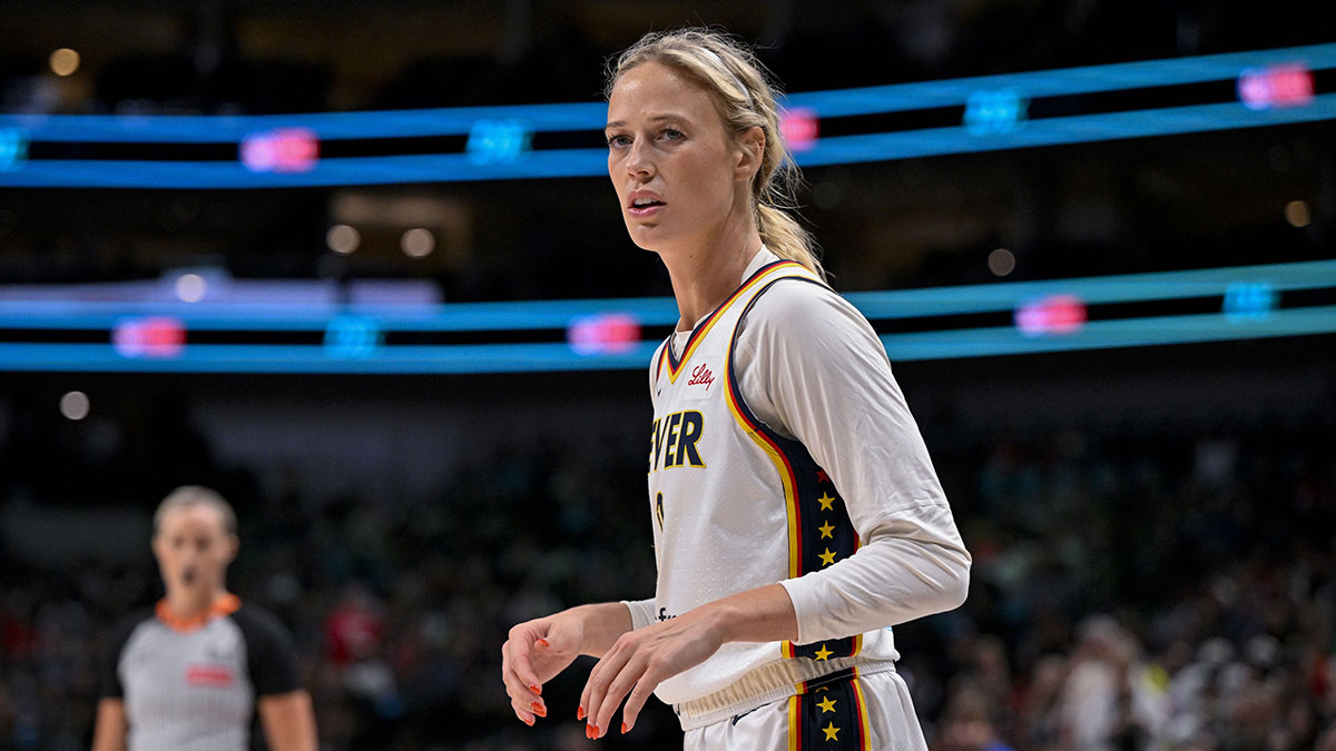 Fever's Sophie Cunningham assisted off court after apparent knee injury
