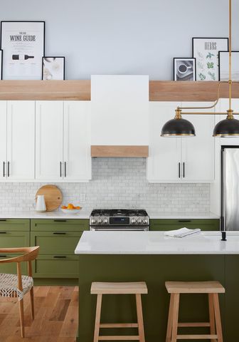 A kitchen with olive green cabinets