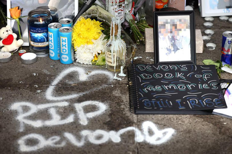 Flowers, balloons and tributes line precinct after boy, 15, killed in e ...