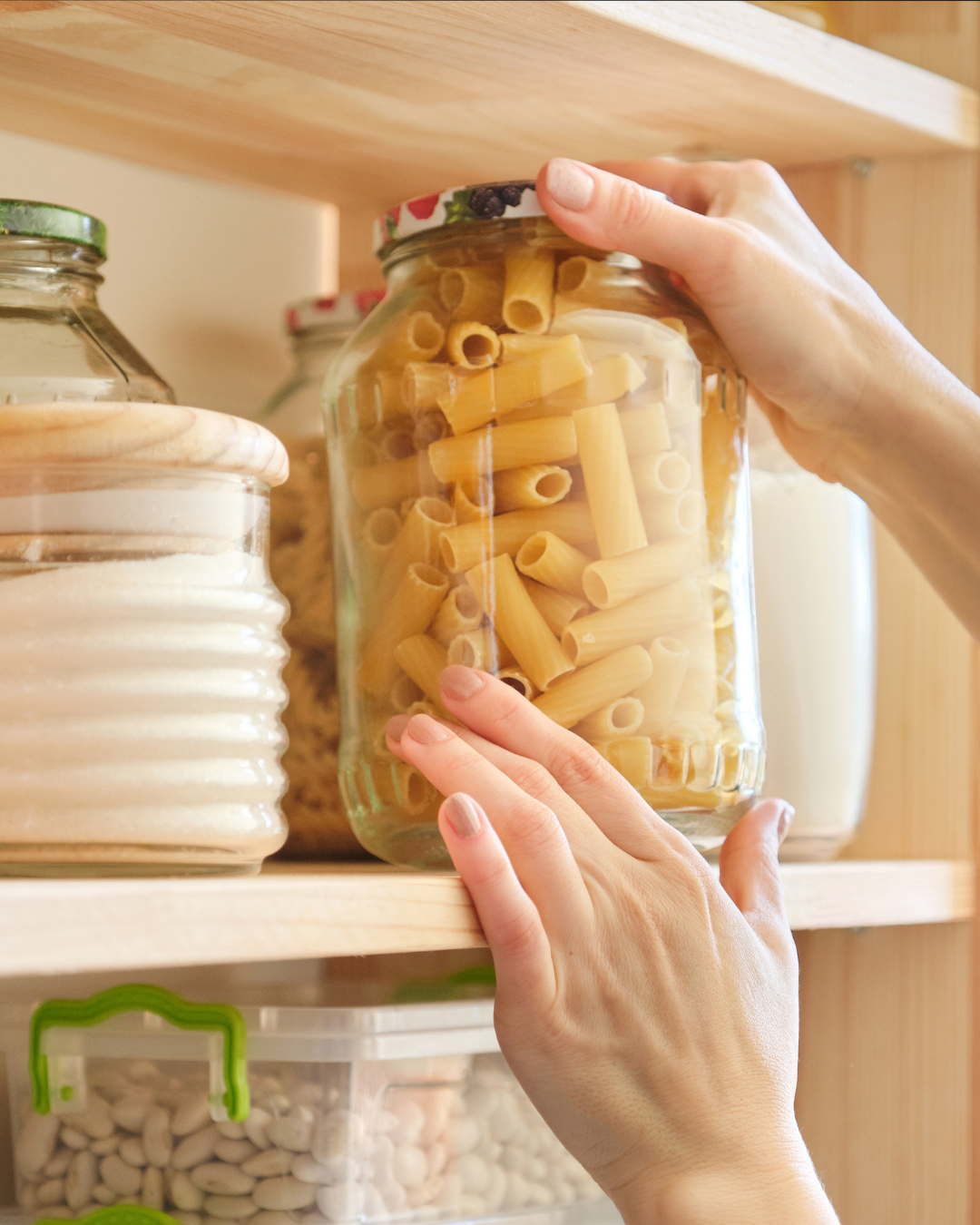 placing. ajar of pasta on the shelf