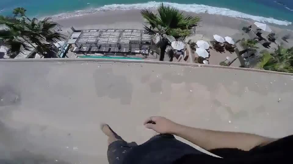 Man Jumps off Roof and Into Swimming Pool