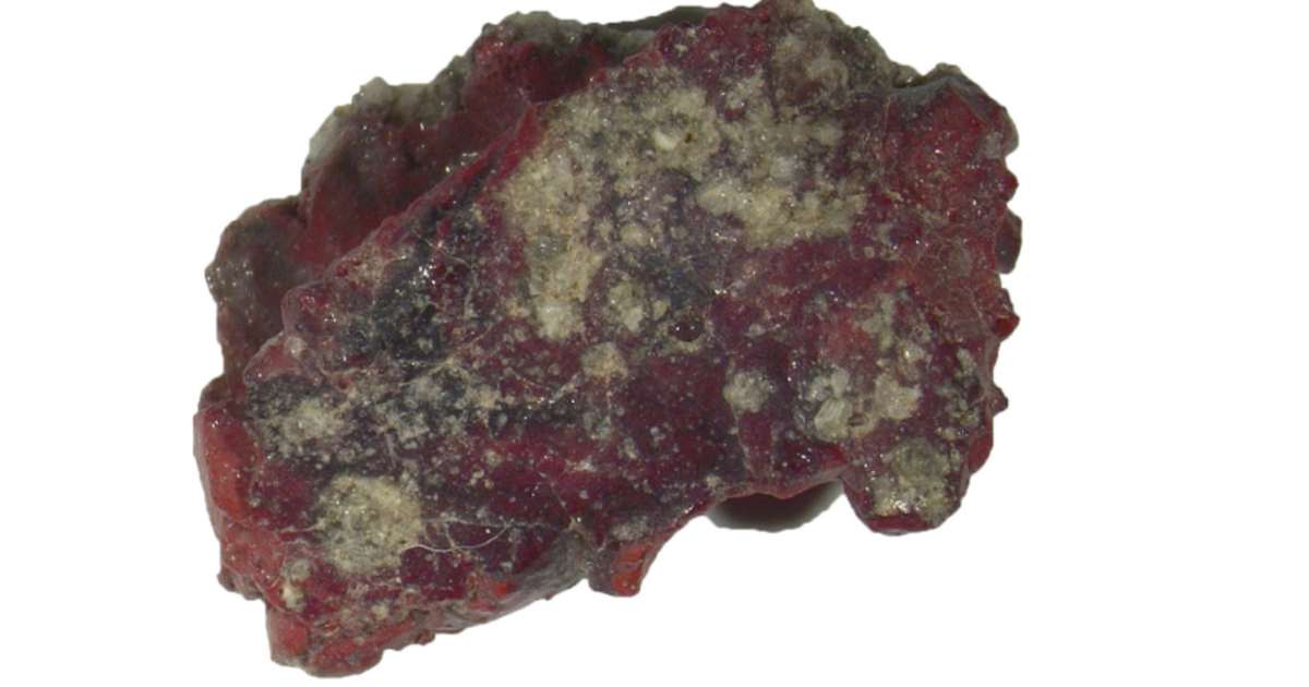 Incident light images of the red trinitite sample (front and back of the sample. ( Image Source: PNAS | Luca Bindi.)