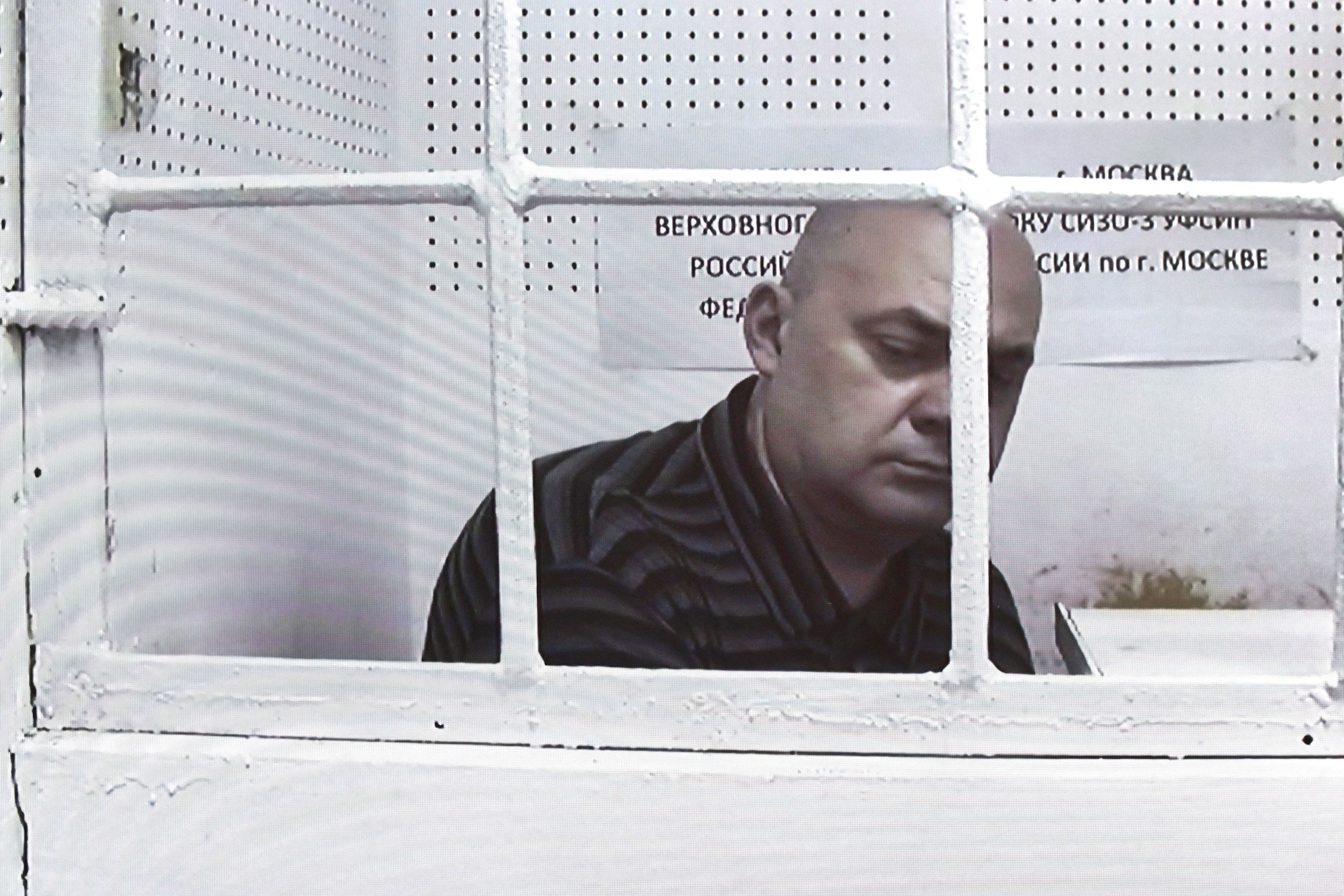 Alexei Smirnov, the former governor of Russia’s Kursk region, attends a court hearing via video link in Moscow on July 16. He was arrested along with his ex-deputy on suspicion of embezzling more than $12 million of funds earmarked for border defenses with Ukraine.