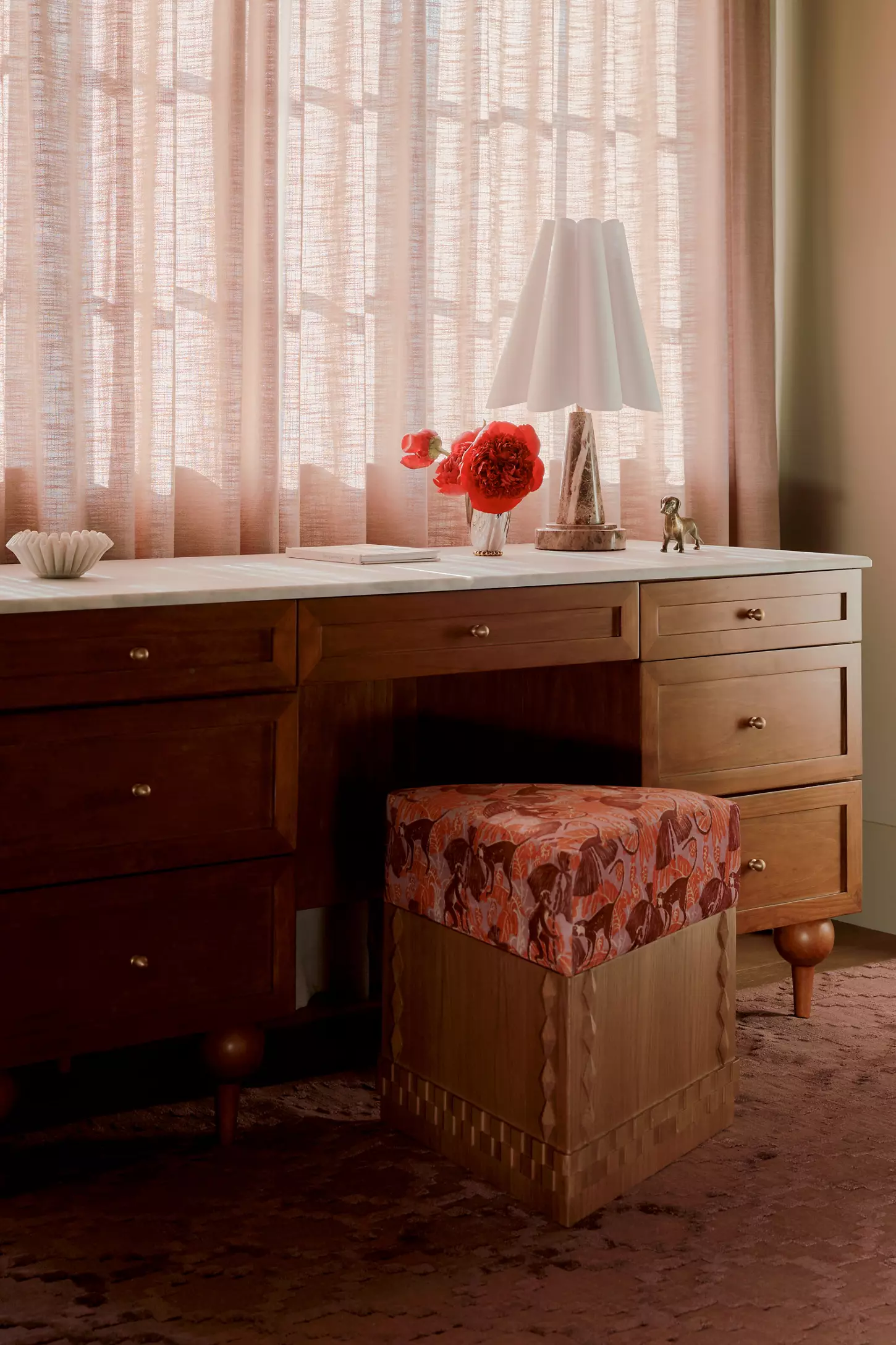Anthropologie triangular storage ottoman in desk area