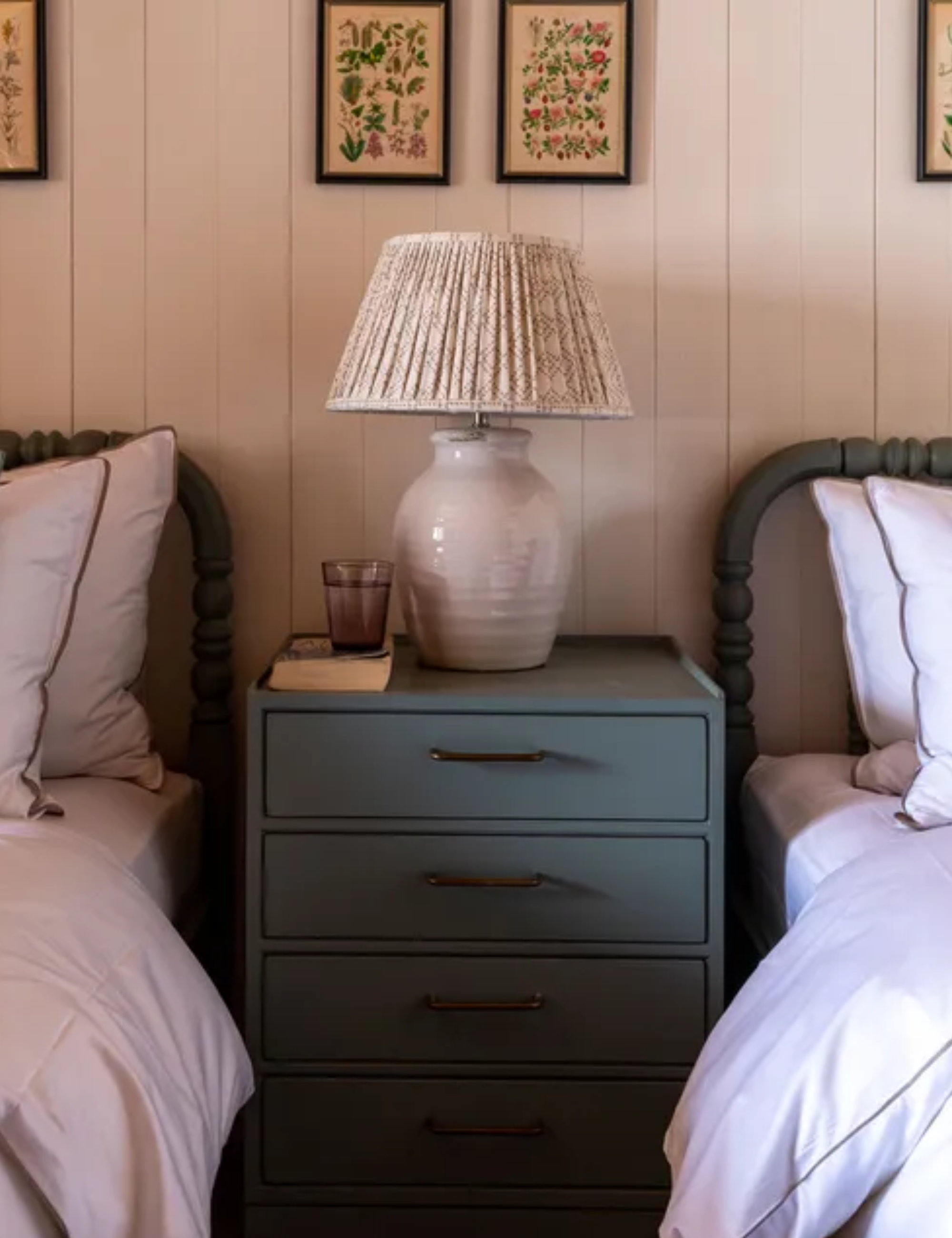 twin bedroom with botanical prints in Swiss chalet by Sims Hilditch