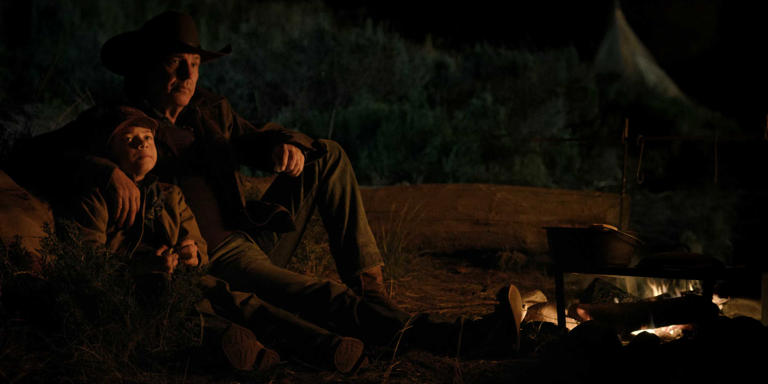 John and Tate sit by the campfire in Yellowstone Season 3, Episode 1