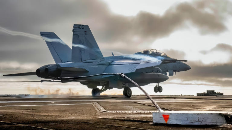 A U.S. Navy F/A-18F Super Hornet, assigned to the Black Knights of Strike Fighter Squadron (VFA) 154, lands on the flight deck of Nimitz-class aircraft carrier USS Theodore Roosevelt (CVN 71), July 24, 2025. Theodore Roosevelt, flagship of Carrier Strike Group (CSG) 9, is underway conducting exercises to bolster strike group readiness and capability in the U.S. 3rd Fleet area of operations. (U.S. Navy photo by Mass Communication Specialist 3rd Class Aaron Haro Gonzalez)