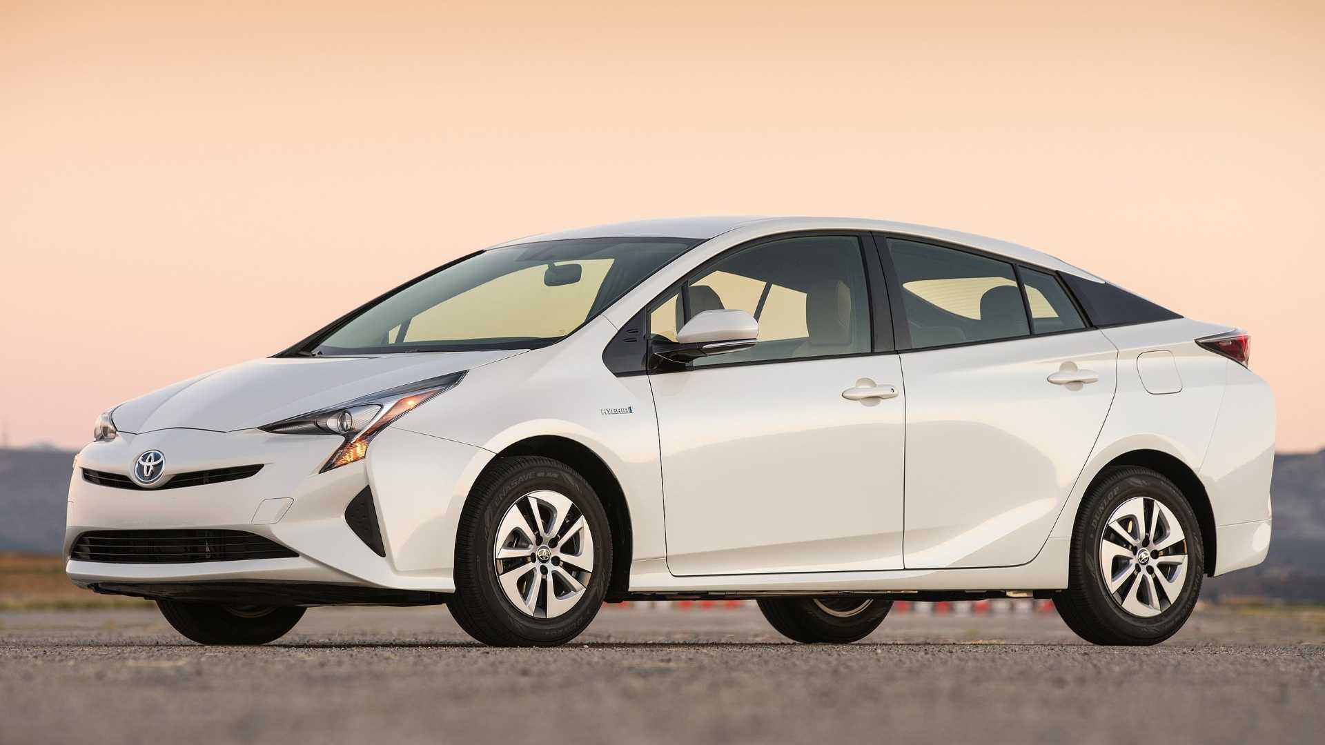 white 2016 Toyota Prius posing on racetrack