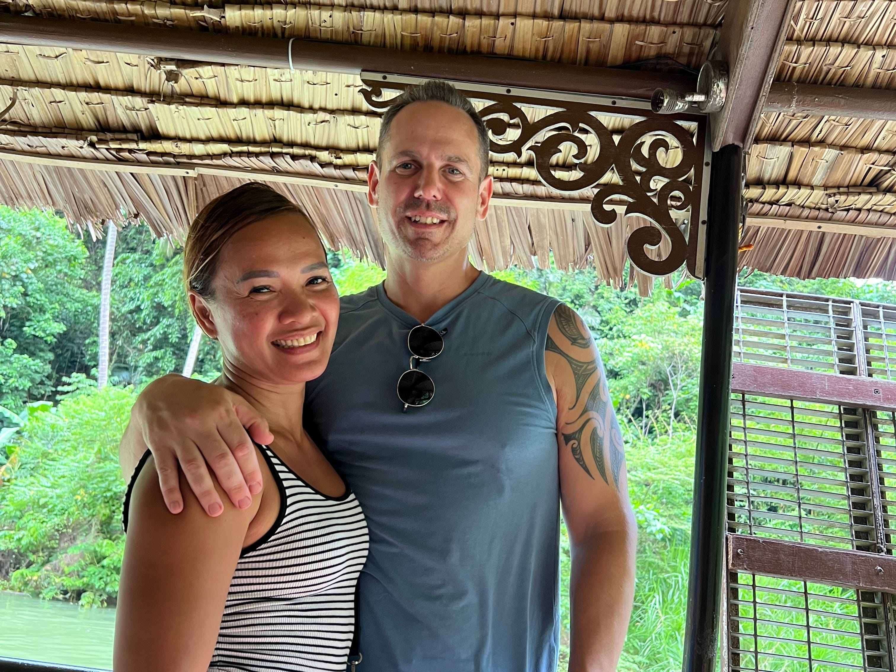 A couple posing for a photo.