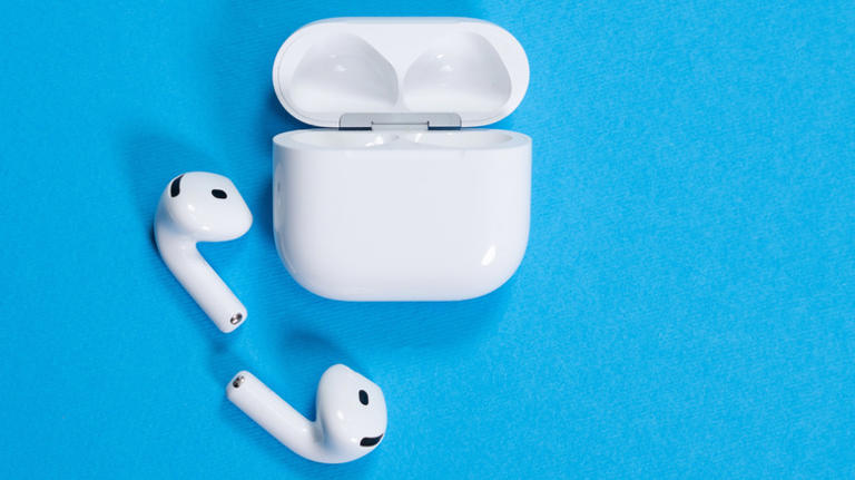 AirPods 4 wireless earbuds and open charging case on a vibrant blue background