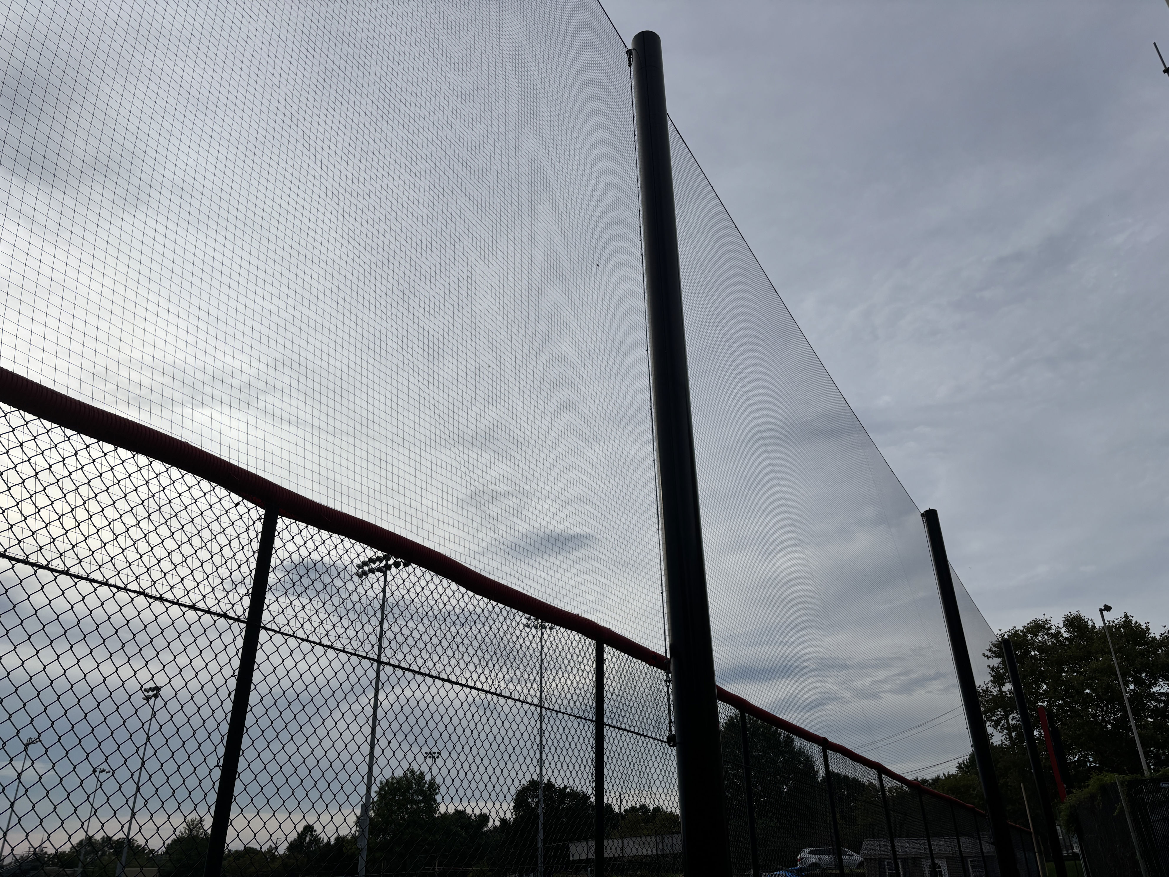 Net fencing at the field is designed to stop home runs from soaring onto the fire station or cars in a parking lot. Some big home runs still clear it.