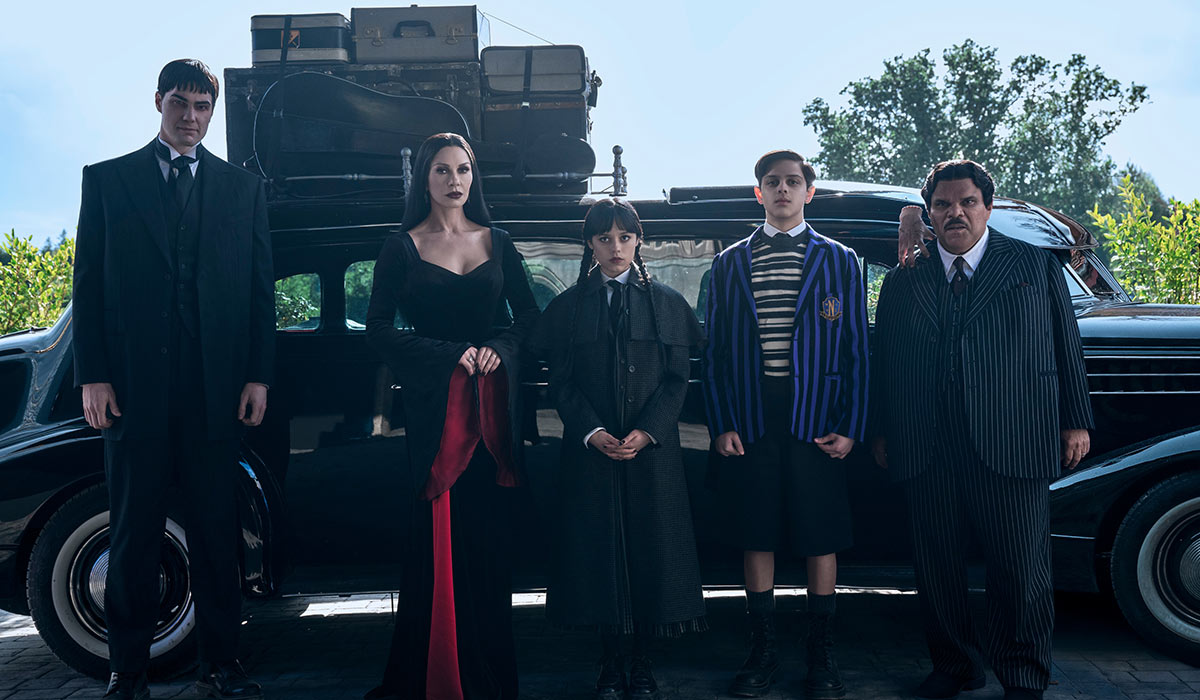 Wednesday. (L to R) Joonas Suotamo as Lurch, Catherine Zeta-Jones as Morticia Addams, Jenna Ortega as Wednesday, Isaac Ordonez as Pugsley Addams, Thing, Luis Guzmán as Gomez Addams in episode 201 of Wednesday. Pic: Netflix