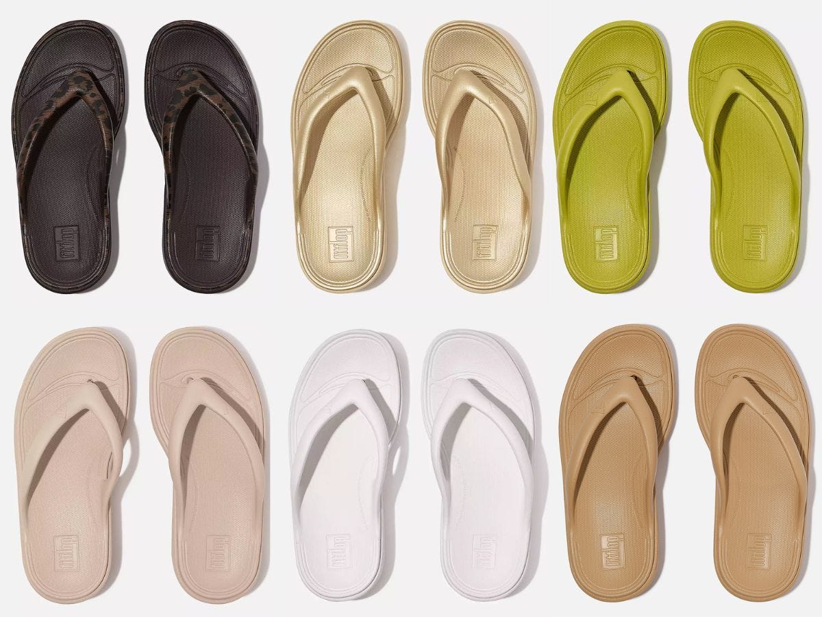 A colorful array of six pairs of flip flops.