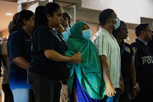 Family and friends of Didarul Islam, who was shot and killed by a gunman Monday evening, watch his dignified transfer out of NewYork-Presbyterian/Weill Cornell Medical Hospital to the medical examiner's office, early Tuesday, July 29, 2025, in New York. (AP Photo/Angelina Katsanis) (AP)