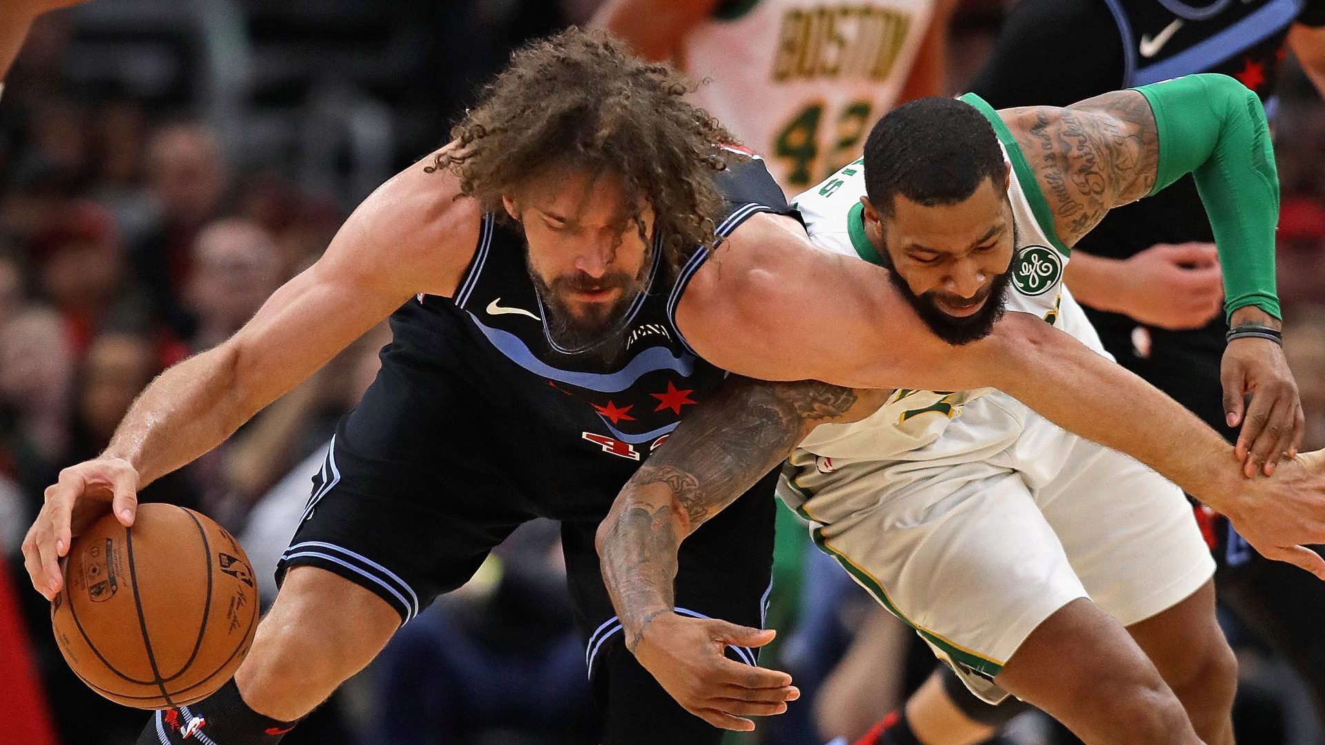 Marcus Morris formerly of the Boston Celtics fouls Robin Lopez.