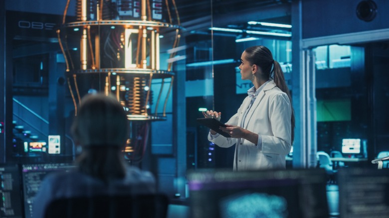 Scientist in a Lab Coat looking at a machine