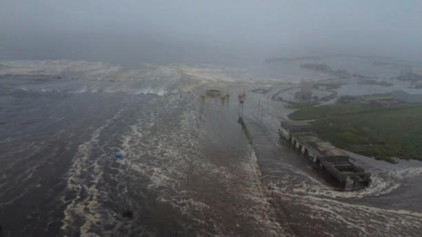 Tsunami waves flood an area in Severo-Kurilsk, Russia, after an earthquake in the Kamchatka Peninsula.