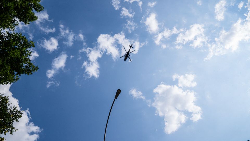 A police helicopter flies over the Jame Masjid Mosque in the Bronx. - Timothy Fadek for CNN