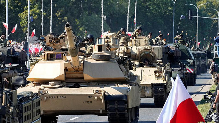 US-made Abrams tanks purchased by Poland take part in a military parade in Warsaw, Poland, on 15 August 2023.