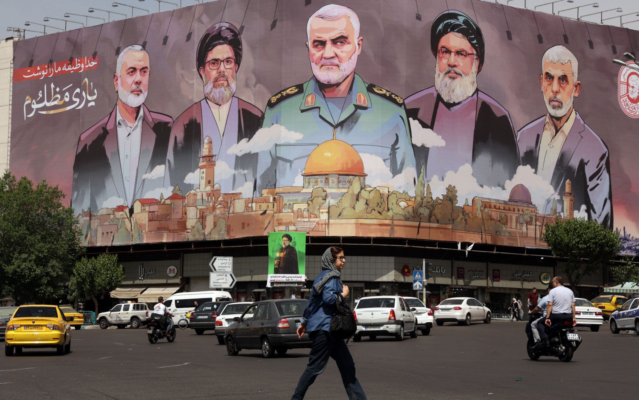 Pictures of late Iranian Islamic Revolutionary Guard Corps adorn a billboard in Tehran