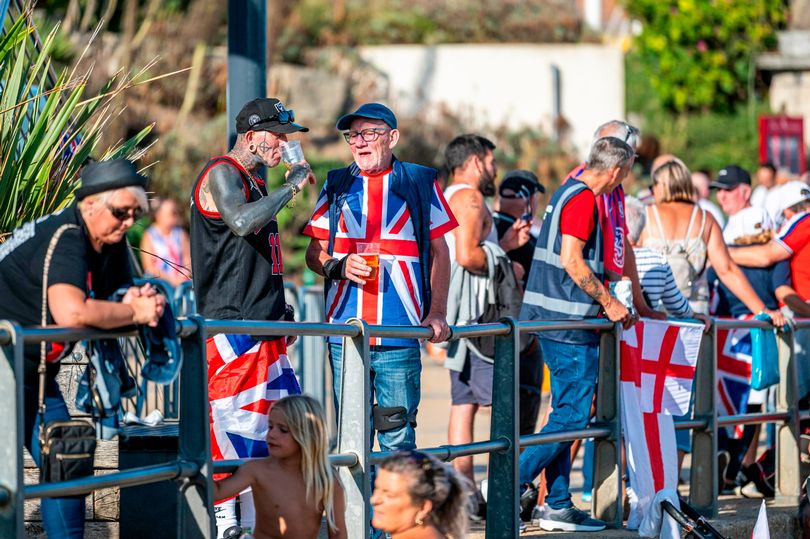 The Safeguard Force, wearing blue vests, were seen during a gathering on the beach in Bournemouth on Saturday