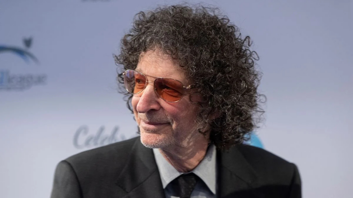A white man wearing a black suit looks to the left. Getty Images
