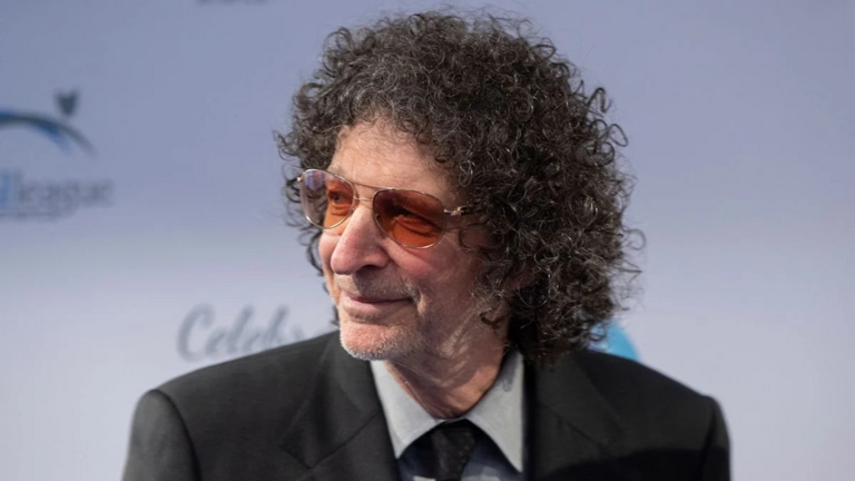 A white man wearing a black suit looks to the left. Getty Images