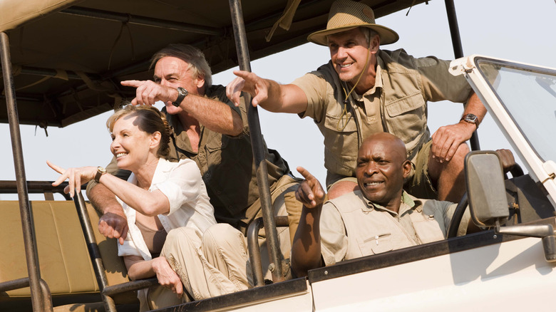 Four people on safari on an all-terrain vehicle