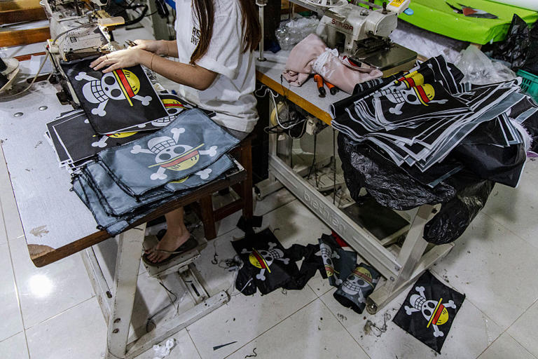 A worker prepares orders of pirate flags from the Japanese anime One Piece at a T-shirt workshop in Karanganyar, Central Java, Indonesia, on Aug. 10, 2025. Ulet Ifansasti—Getty Images