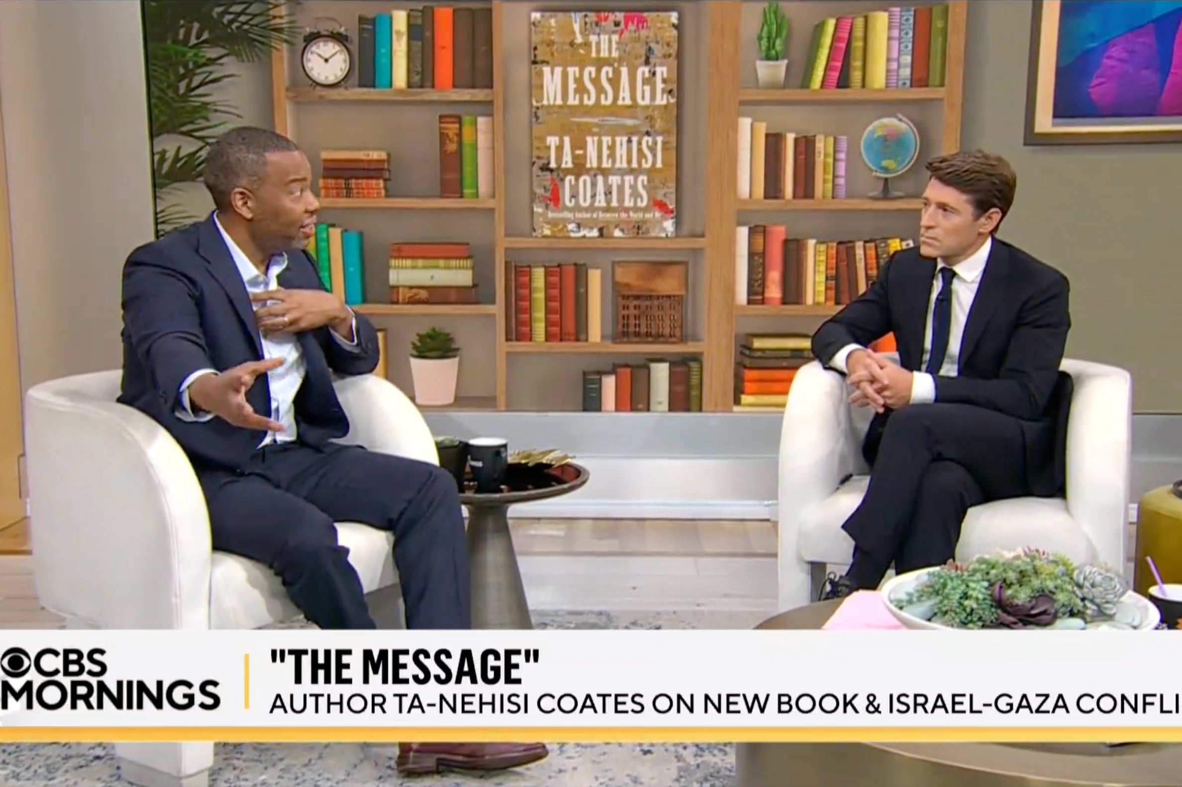 Ta-Nehisi Coates, left, sits for an interview with 