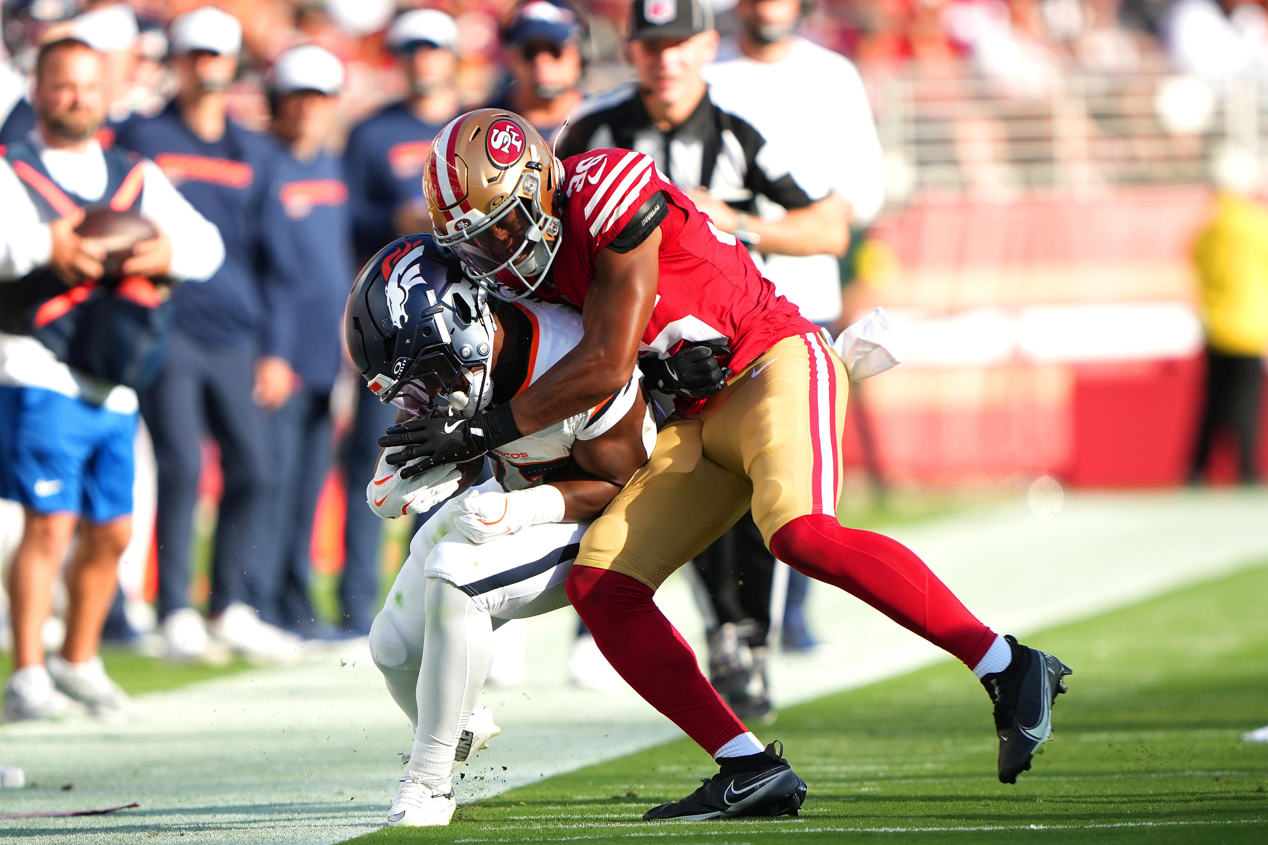 SANTA CLARA, CALIFORNIA - AUGUST 09: Marques Sigle #36 of the San Francisco 49ers tackles RJ Harvey #37 of the Denver Broncos in the first half during the NFL Preseason 2025 game at Levi's Stadium on August 09, 2025 in Santa Clara, California. (Photo by Thearon W. Henderson/Getty Images)