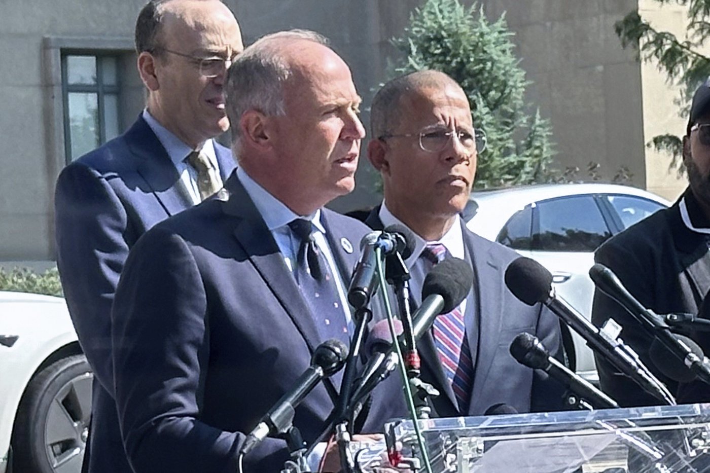 FILE - Brian Schwalb, attorney general for the District of Columbia, center, speaks outside the federal courthouse, Sept. 3, 2024 in Washington. (AP Photo/Lindsay Whitehurst, File)