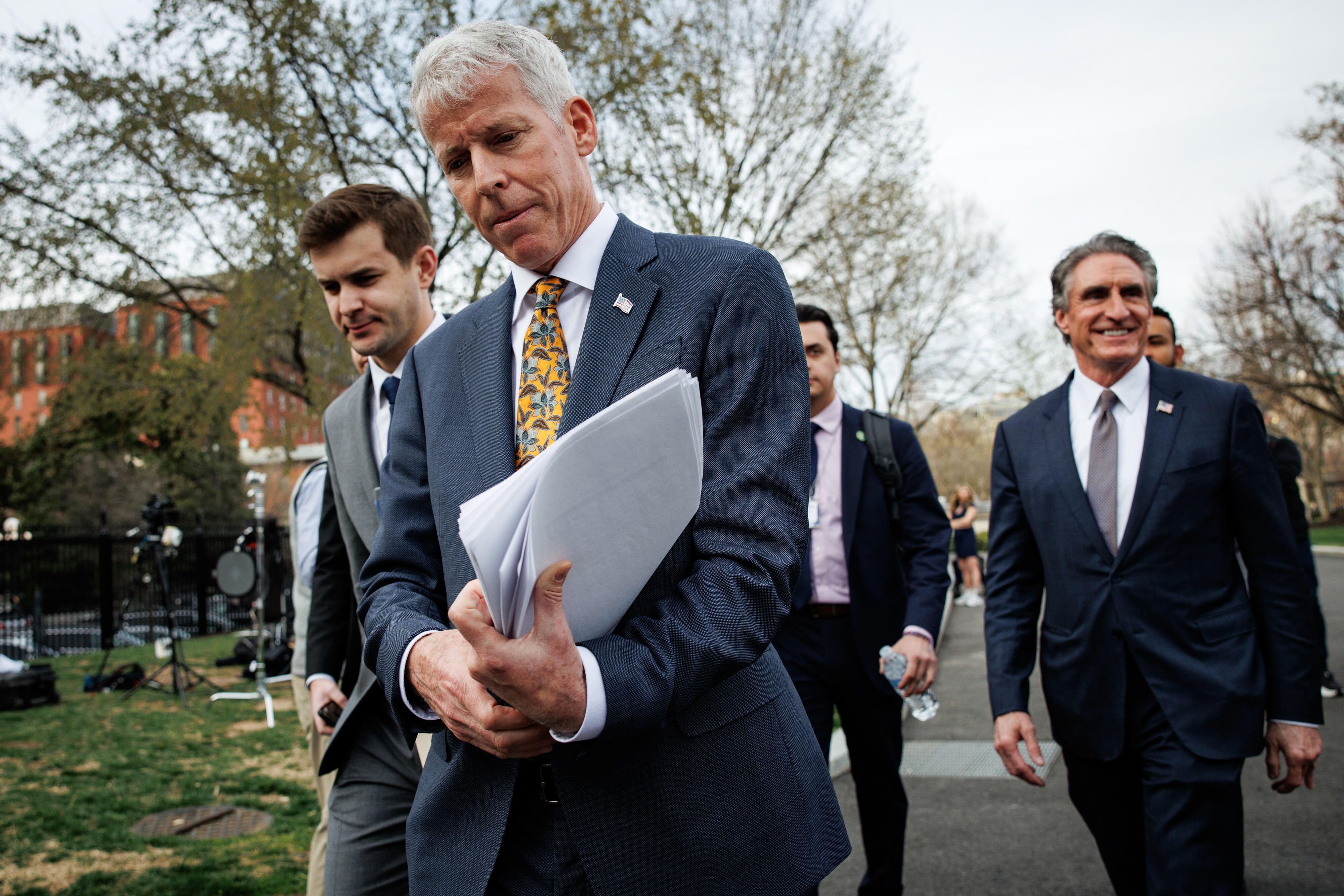 Energy Secretary Chris Wright, center, with Interior Secretary Doug Burgum, right, outside the White House on March 19, 2025. / Credit: Samuel Corum/Sipa/Bloomberg via Getty Images