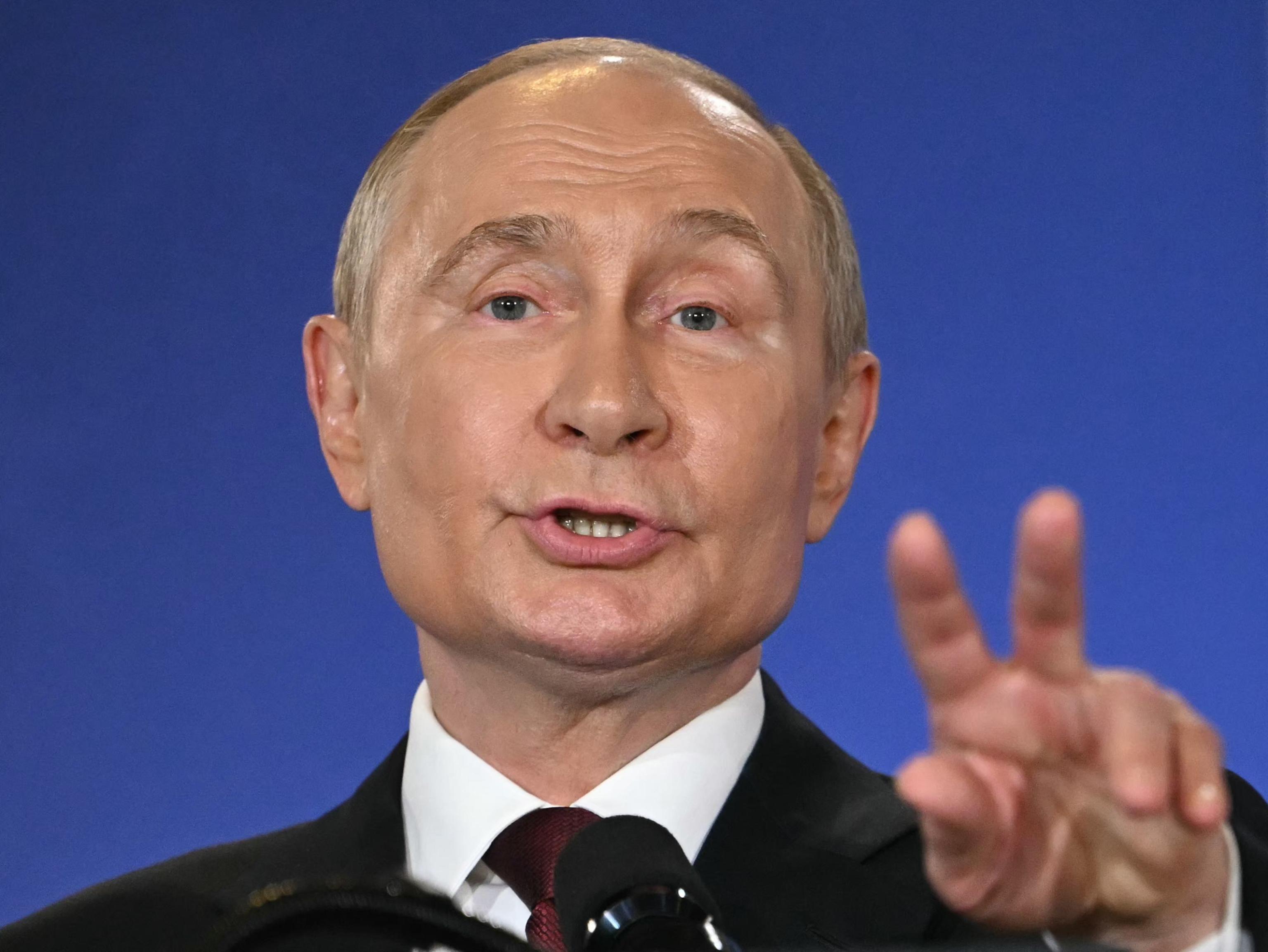 Russian President Vladimir Putin gestures as he speaks during a joint press conference with US President Donald Trump (out of frame) after participating in a US-Russia summit on Ukraine at Joint Base Elmendorf-Richardson in Anchorage, Alaska, on August 15, 2025. (Photo by ANDREW CABALLERO-REYNOLDS / AFP)