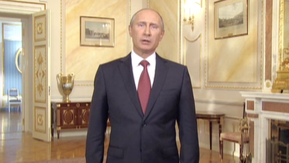 Russian President Vladimir Putin delivers a video address in English in 2013. - Kremlin
