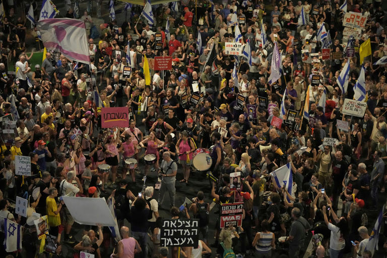 An anti-war demonstration in Tel Aviv on Saturday (AP)