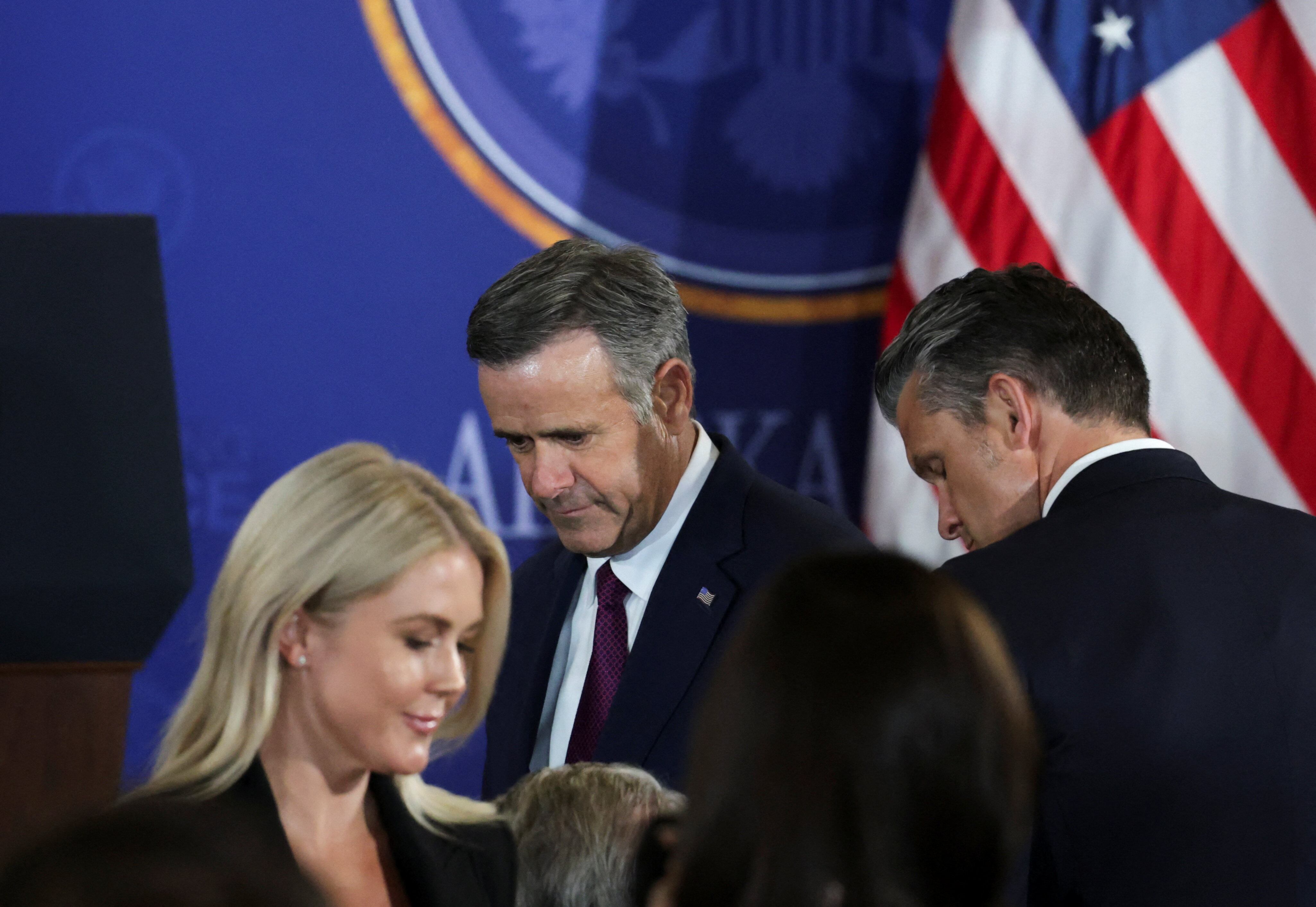 White House Press Secretary Karoline Leavitt, CIA Director John Ratcliffe, and Defense Secretary Pete Hegseth gather ahead of a joint press conference between President Donald Trump and Russian President Vladimir Putin following the leaders' three-hour meeting. / Jeenah Moon/Reuters