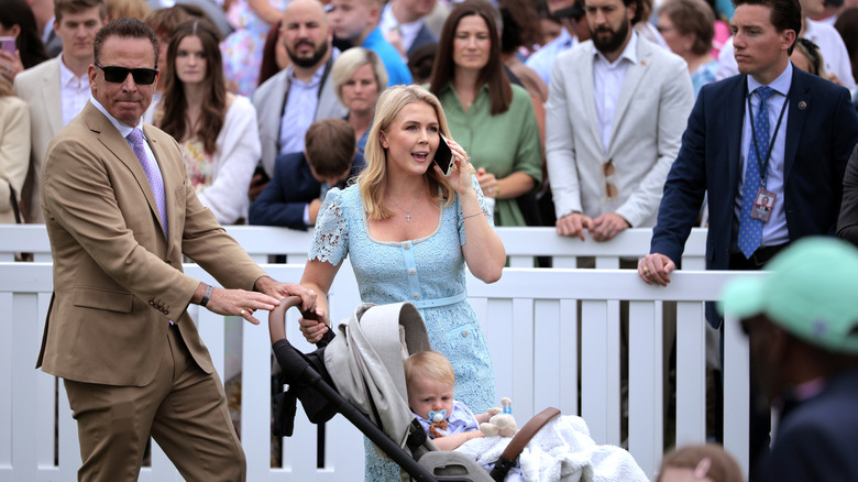 Nicholas Riccio and Karoline Leavitt seen with their son at White House event in April 2025