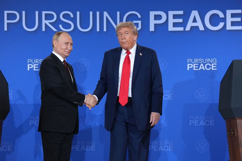 President Donald Trump (R) and Russian President Vladimir Putin shake hands at the end of a press conference at Joint Base Elmendorf-Richardson on August 15, 2025 in Anchorage, Alaska.