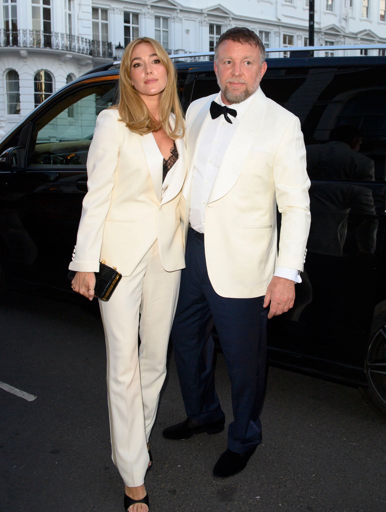 Guy Ritchie and lace-clad wife Jacqui manifest 'change and growth' at ...