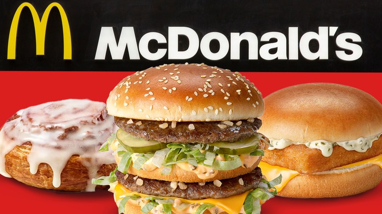 A cinnamon roll, Big Mac, and Filet O' Fish on a red and black background with the McDonald's logo