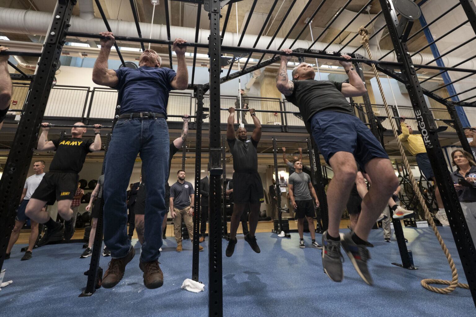 Robert F. Kennedy Jr. wearing a pair of jeans as he works out alongside Pete Hegseth for their MAHA fitness challenge. / Defense Department