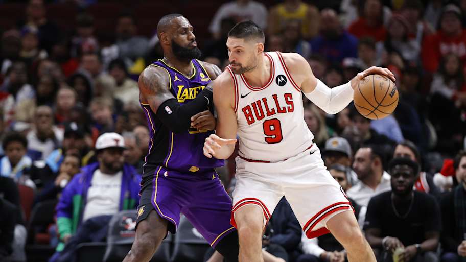 Dec 20, 2023; Chicago, Illinois, USA; Los Angeles Lakers forward LeBron James (23) defends against Chicago Bulls center Nikola Vucevic (9) during the second half at United Center. Mandatory Credit: Kamil Krzaczynski-Imagn Images | Kamil Krzaczynski-Imagn Images